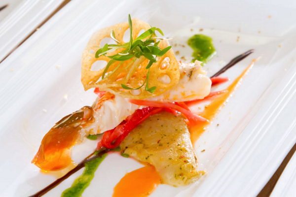 Lionfish- a plate of food with a fork