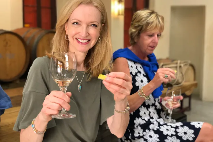 a woman holding a wine glass