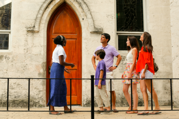 a group of people standing in front of a building