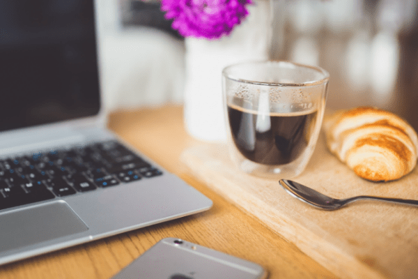 WiFi7-Greg a laptop computer sitting on top of a wooden table