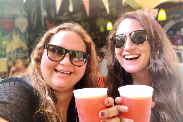 a woman wearing sunglasses and a cup of coffee